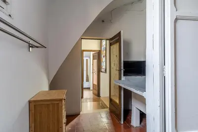 a kitchen with a counter and a hallway with an attic at Canela Homes BARCELONA RAMCAT37 in Barcelona