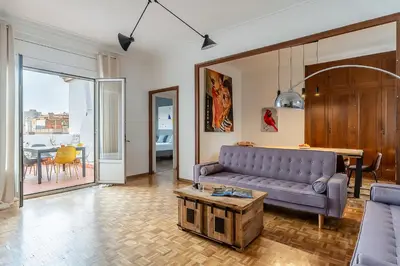 a living room with a couch and a table at Canela Homes BARCELONA RAMCAT37 in Barcelona