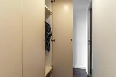 a walk in closet with a glass door at Canela Homes BARCELONA ART in Barcelona