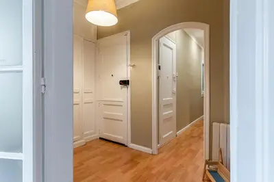 an empty hallway with a door and a mirror at Canela Homes BARCELONA ROSSELLÓ in Barcelona
