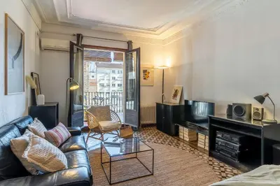 a living room with a couch and a television at Canela Homes BARCELONA VLC306 in Barcelona