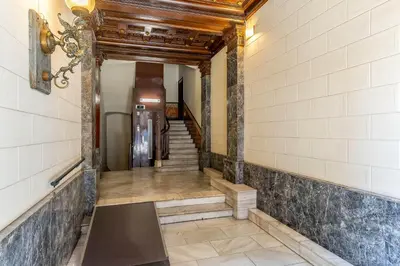 a hallway with stairs and a stair case at Canela Homes BARCELONA VLC306 in Barcelona