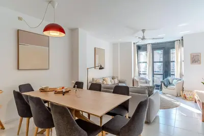 a dining room with a table and chairs at Canela Homes BARCELONA NINOT in Barcelona