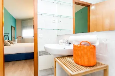 a bathroom with a sink and a mirror at Apartment Bright Sagrada Familia in Barcelona