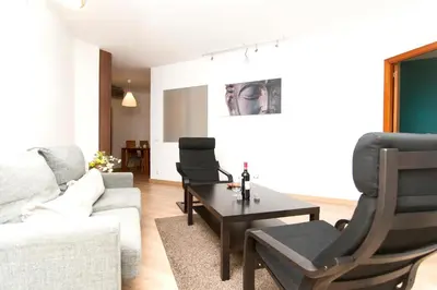 a living room with a couch and a table at Apartment Bright Sagrada Familia in Barcelona
