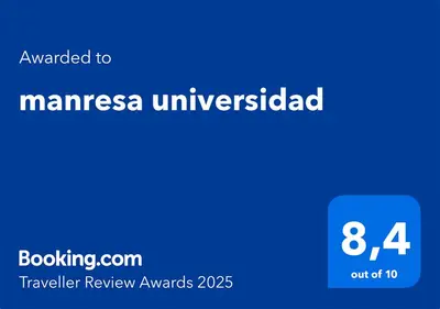a blue sign with the words mannesza univicked at manresa universidad in Manresa