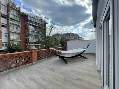 a hammock on the balcony of a building at manresa universidad in Manresa