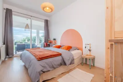 a bedroom with a bed and a large window at Villa Nova Vida Barcelona in Teià