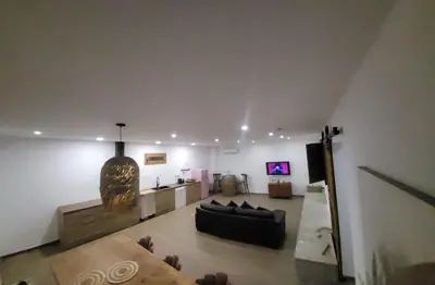 a living room with a couch and a table at Villa Urbina in Olerdola