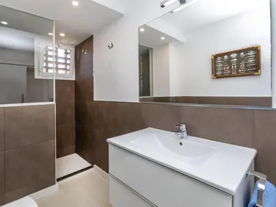 a bathroom with a sink and a mirror at Apartment Clipper by Interhome in Sant Vicenç de Montalt