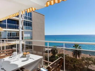 a balcony with a table and a view of the ocean at Apartment Clipper by Interhome in Sant Vicenç de Montalt