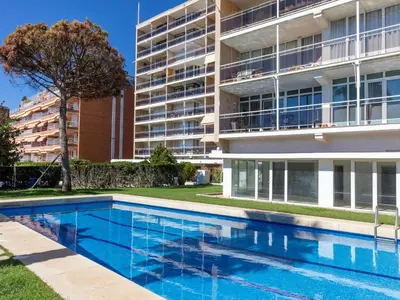 a swimming pool in front of a building at Apartment Clipper by Interhome in Sant Vicenç de Montalt