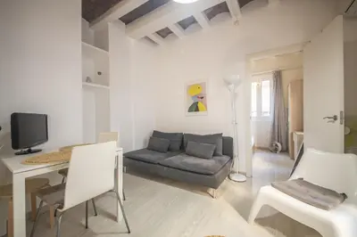 a living room with a couch and a table at Catalunya Casas Lovely apartment central Barcelona 100m to beach! in Barcelona