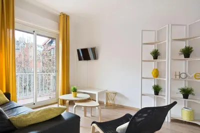 a living room with a couch and a window at Stay U-nique Apartments Gaudi I in Barcelona