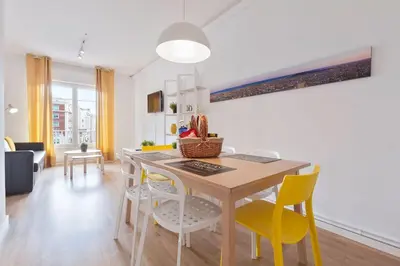 a kitchen and dining room with a table and chairs at Stay U-nique Apartments Gaudi I in Barcelona