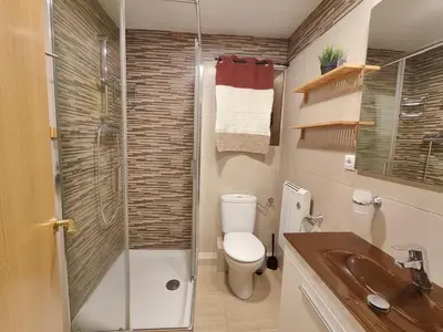 a bathroom with a shower and a toilet and a sink at Family apartment Besos 2 in Sant Adria de Besos