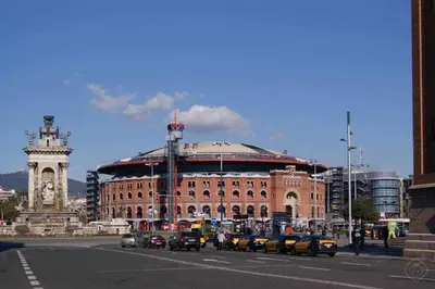 a large building with a clock tower in a city at Port I Espectacular apartament con terraza in Barcelona