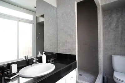 a bathroom with a sink and a toilet at BarcelonaForRent The Claris Suites I in Barcelona