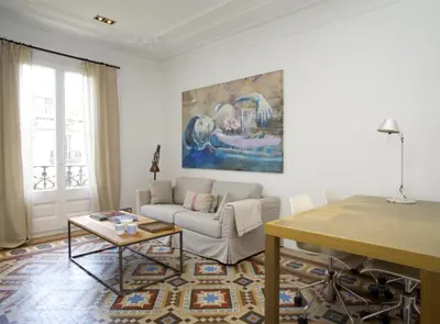 a living room with a couch and a table at BarcelonaForRent The Claris Suites I in Barcelona