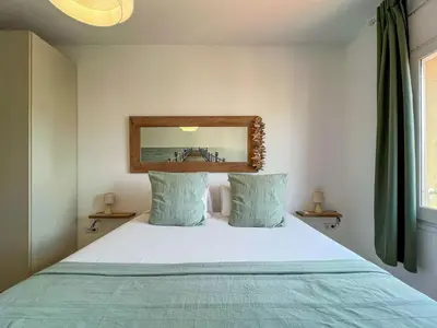 a bedroom with a bed and a mirror on the wall at Stay U-nique Apartments Rambla Catalunya V in Barcelona