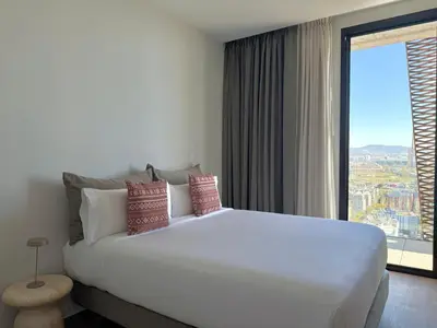 a living room with a couch and a balcony at Tembo Barcelona in Barcelona
