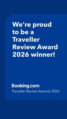 a blue sign that says were proud to be a traveller reviewagency winner at Casa de invitados in La Torre de Claramunt