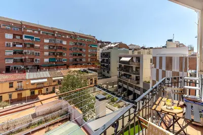 a view of a city from a balcony with buildings at Canela Homes BARCELONA FIRA in Barcelona