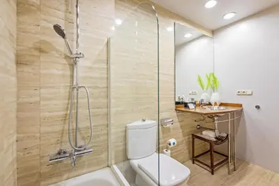 a bathroom with a shower and a toilet and a sink at Plaza Catalunya in Barcelona