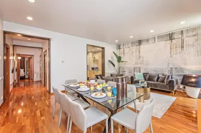 a dining room and living room with a table and chairs at Plaza Catalunya in Barcelona