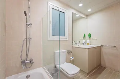 a bathroom with a shower and a toilet and a sink at Plaza Catalunya in Barcelona