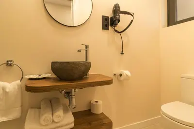 a bathroom with a sink and a mirror at MarPlana in Castelldefels