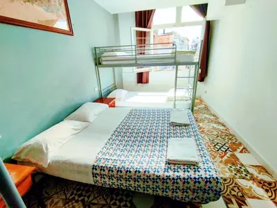 a bedroom with a bunk bed in a room at Alberg Sants Bcn in Barcelona