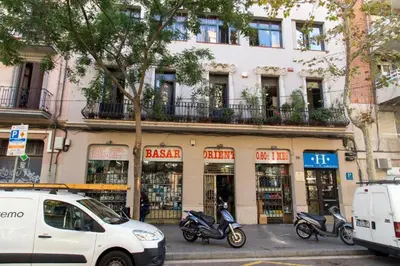 a group of motorcycles parked in front of a building at Alberg Sants Bcn in Barcelona