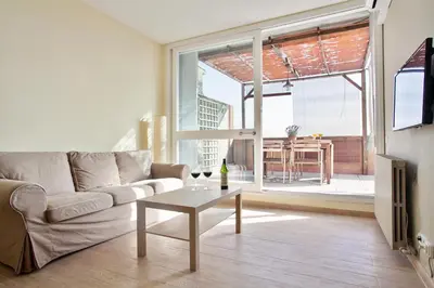 a living room with a couch and a table at Stay U-nique Apartments Marina III in Barcelona