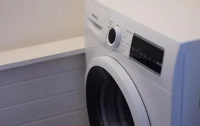 a white washing machine sitting in a room at Stay U-nique Apartments Granados in Barcelona
