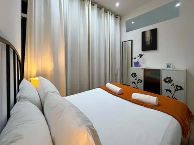 a bedroom with a large white bed with white pillows at Stay U-nique Apartments Caminal in Barcelona