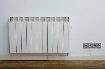 a radiator in a room with a white wall at Beach Castelldefels in Castelldefels