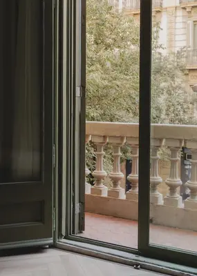 an open door looking out onto a balcony at Casa Llimona Hotel Boutique in Barcelona