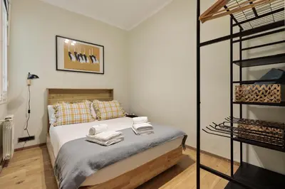 a bedroom with a bed with towels on it at Enjoy Apartments Donna in Barcelona