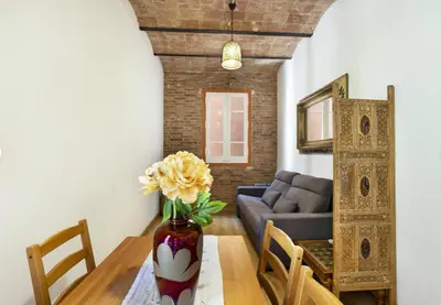 a living room with a table and a couch at Great apartment in Sagrada Familia with Balcony in Barcelona