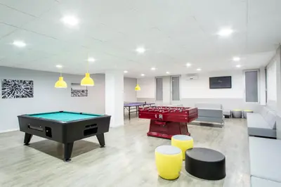 a room with a pool table and ping pong balls at Residencia Universitaria Resa Lesseps in Barcelona