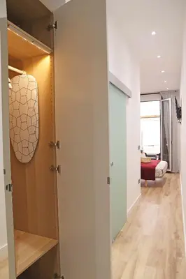 a hallway with a door leading to a bedroom at Hostal Gràcia in Barcelona