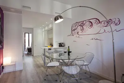 a dining room with a table and chairs at Habitat Apartments ADN in Barcelona