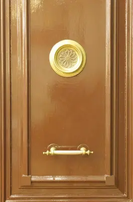 a bronze door with a handle on it at Casa Balmes in Barcelona