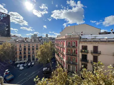 a view of a city with buildings and a blue sky at Stay U-nique Apartments Pau Claris II in Barcelona