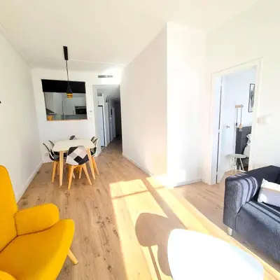 a living room with a couch and a table at G74 AVENIDA GAUDI nice 4 bedrooms apartment with balcony with views of the Basilica Sagrada Familia in Barcelona