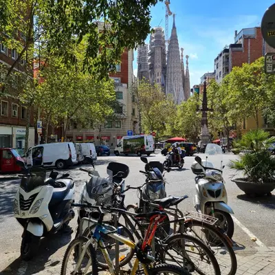 a group of bikes parked on a city street at G74 AVENIDA GAUDI nice 4 bedrooms apartment with balcony with views of the Basilica Sagrada Familia in Barcelona