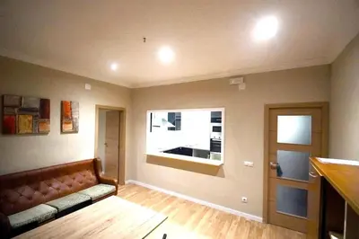 a living room with a couch and a window at MERIDIANA CLOT 4 bedrooms 2 bathrooms in Barcelona