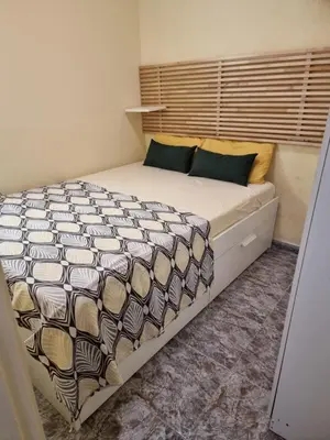 a bedroom with a large bed in a room at 2 bedrm BCN down AC WIFI 30 nigths min in Barcelona