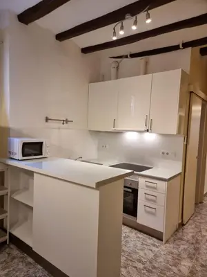 a kitchen with white cabinets and a microwave at 2 bedrm BCN down AC WIFI 30 nigths min in Barcelona